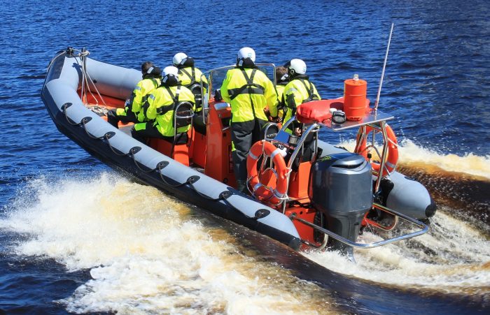 Strategic Security - rescue team on water raft